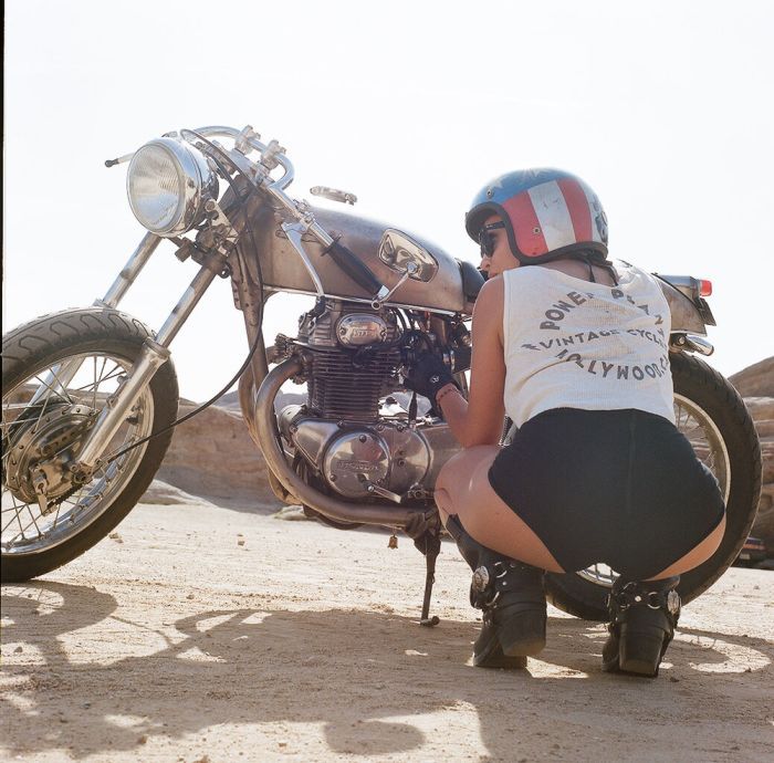 A playful frame from Girls on a motorcycle — online in Qingdao